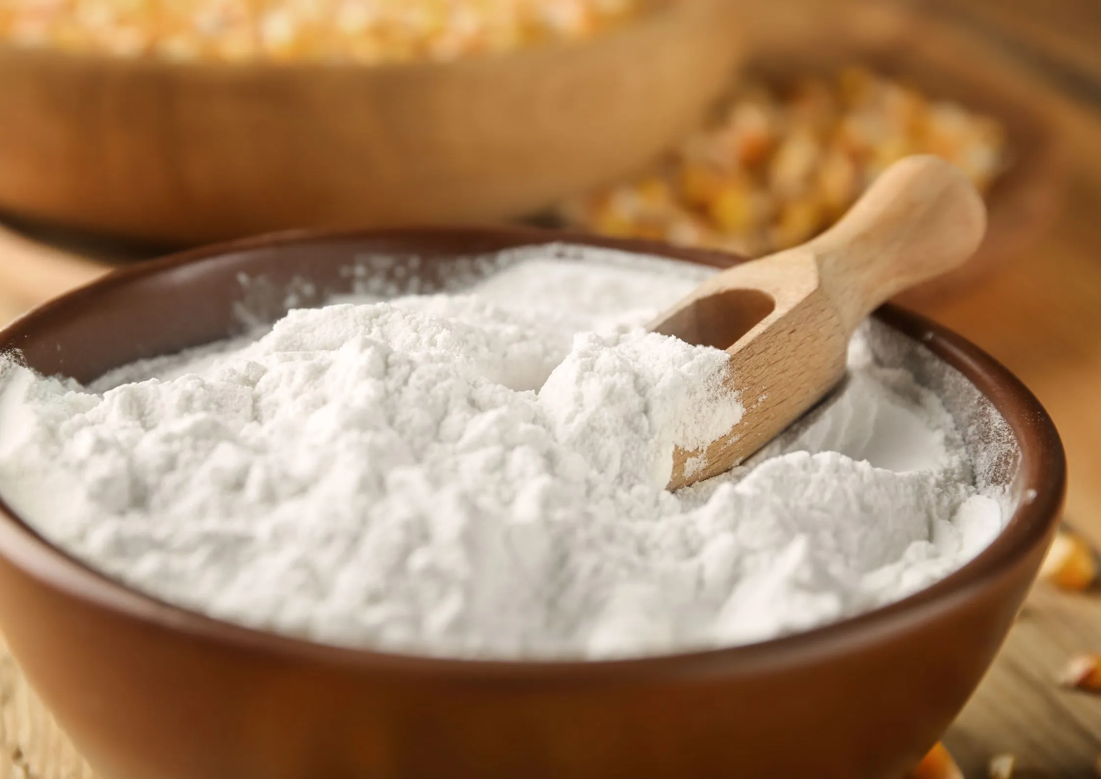 Corn syrup solids in bowl with scoop