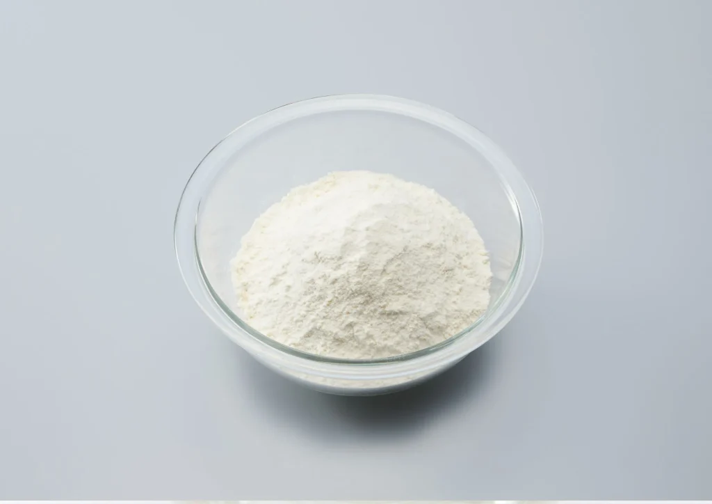 Non-GMO verified maltitol powder in a transparent glass bowl, suitable for health-conscious sweetener applications.